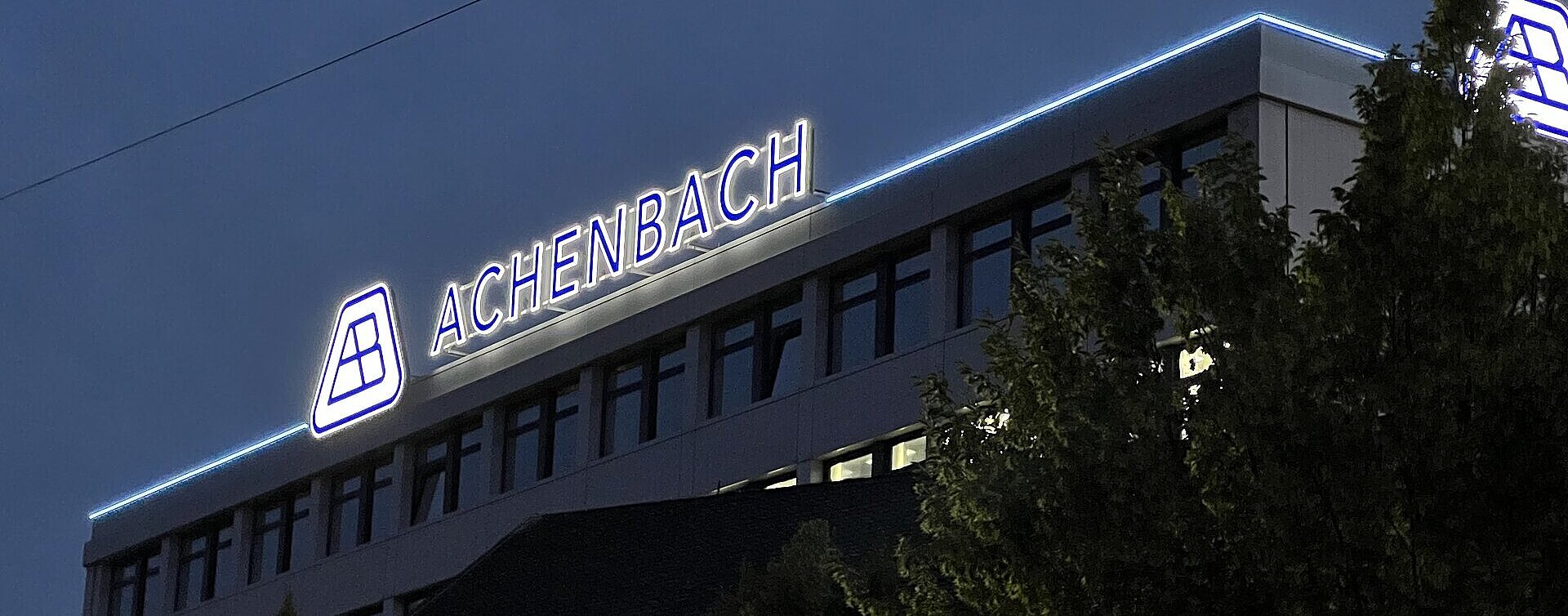 Achenbach Buschhütten company building with illuminated lettering