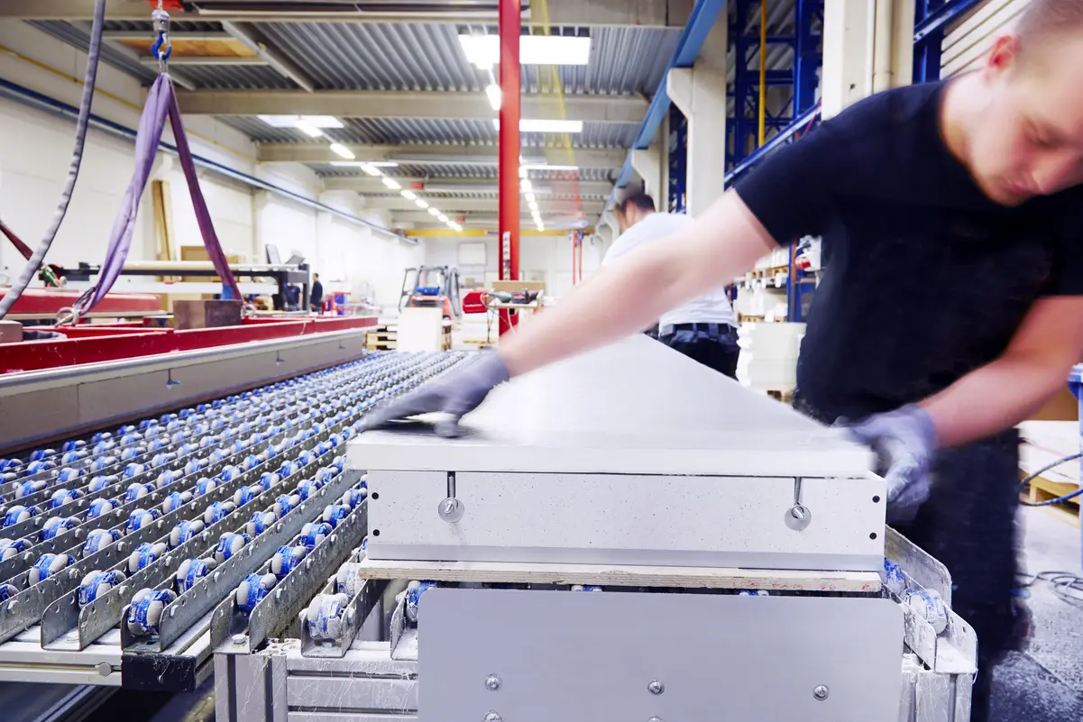 Work situation in which a man works on a part