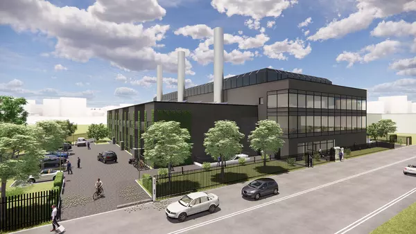 Visualization data center Bad Vilbel. Building, next to it people, cars and trees